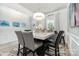 Bright dining room with modern light fixture, stylish decor, and adjacent doorway at 123 Clauser N Rd, Mount Holly, NC 28120