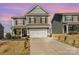 Charming two-story home with a two-car garage and manicured landscaping at 123 Clauser N Rd, Mount Holly, NC 28120