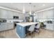 Bright kitchen featuring an island with quartz countertop, stainless steel appliances, and pendant lighting at 123 Clauser N Rd, Mount Holly, NC 28120
