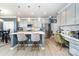 Modern kitchen with quartz countertop island and stainless steel appliances, with bar stool seating at 123 Clauser N Rd, Mount Holly, NC 28120