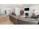 Open-concept living room features a fireplace, large TV, comfortable sectional sofa, and views of the foyer at 123 Clauser N Rd, Mount Holly, NC 28120