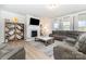 Spacious living room featuring a fireplace, large TV, comfortable sectional sofa, and stylish decor at 123 Clauser N Rd, Mount Holly, NC 28120