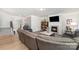 Open-concept living room features a fireplace, large TV, comfortable sectional sofa, and views of the foyer at 123 Clauser N Rd, Mount Holly, NC 28120