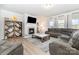 Spacious living room featuring a fireplace, large TV, comfortable sectional sofa, and stylish decor at 123 Clauser N Rd, Mount Holly, NC 28120