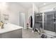 Well-lit main bathroom with a glass-enclosed shower and double sink vanity at 123 Clauser N Rd, Mount Holly, NC 28120