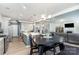 Open-concept kitchen and living area with modern appliances, island seating, and comfortable living space at 123 Clauser N Rd, Mount Holly, NC 28120