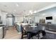 Open-concept kitchen and living area with modern appliances, island seating, and comfortable living space at 123 Clauser N Rd, Mount Holly, NC 28120