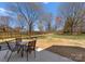 Patio with an outdoor seating area and view of a large grassy backyard and fence at 123 Southhaven Dr, Mooresville, NC 28117