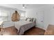 Bedroom with a bed, hardwood floors, two windows, and a hide hanging on the wall at 123 Southhaven Dr, Mooresville, NC 28117