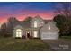 Exterior of a house with landscaped front yard, two-car garage, and inviting front entrance at 123 Southhaven Dr, Mooresville, NC 28117