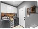 The laundry room features a side by side washer and dryer, overhead storage, and access to the exterior at 123 Southhaven Dr, Mooresville, NC 28117