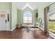 Inviting living room with a vaulted ceiling, large window, and elegant hardwood floors at 123 Southhaven Dr, Mooresville, NC 28117