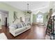 Spacious living room with vaulted ceilings, hardwood floors, and a comfortable seating area at 123 Southhaven Dr, Mooresville, NC 28117