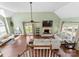 Open concept living room featuring vaulted ceilings, hardwood floors, fireplace, and plenty of seating at 123 Southhaven Dr, Mooresville, NC 28117