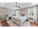 A main bedroom features a ceiling fan, hardwood floors, and bedside tables with lamps at 123 Southhaven Dr, Mooresville, NC 28117