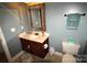 Cozy powder room featuring a modern vanity with stylish fixtures, enhancing functionality and appeal at 1256 Twin Lakes Rd, Rock Hill, SC 29732