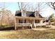 Charming home with a welcoming front porch, dormer windows and manicured lawn on a sunny day at 1256 Twin Lakes Rd, Rock Hill, SC 29732
