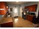 Functional kitchen with stainless steel appliances, tiled floor, and ample counter space at 1256 Twin Lakes Rd, Rock Hill, SC 29732