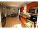 Open kitchen featuring stainless steel appliances, tile floors, and a dining area at 1256 Twin Lakes Rd, Rock Hill, SC 29732