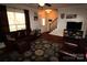 Inviting living room with dark wood floors, a plush sofa, and ample natural light from a large window at 1256 Twin Lakes Rd, Rock Hill, SC 29732