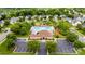Aerial view of the community pool and amenity center surrounded by lush landscaping and parking at 128 Millen Dr, Mooresville, NC 28115