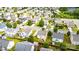 Aerial view of home nestled in a neighborhood with mature trees and well-maintained lawns at 128 Millen Dr, Mooresville, NC 28115