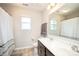 Bright bathroom featuring a double sink vanity, and a shower-tub combo with a decorative shower curtain at 128 Millen Dr, Mooresville, NC 28115