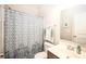 Well-maintained bathroom featuring a shower with curtain and a single-sink vanity at 128 Millen Dr, Mooresville, NC 28115