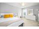 Bright bedroom featuring white furniture, a queen bed, and plenty of natural light from the window at 128 Millen Dr, Mooresville, NC 28115