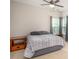 Cozy bedroom with a queen bed, neutral tones, and natural light from the bay windows at 128 Millen Dr, Mooresville, NC 28115