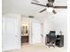 Bright bedroom featuring neutral carpeting, ceiling fan, attached bathroom, and space for a home office setup at 128 Millen Dr, Mooresville, NC 28115