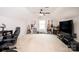 Expansive bonus room with instruments, electronics and large windows for natural light at 128 Millen Dr, Mooresville, NC 28115
