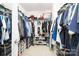 Walk-in closet with racks of clothing and shoes on multiple shelves offering lots of storage space at 128 Millen Dr, Mooresville, NC 28115