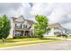 Charming two-story home with stone accents, manicured lawn and beautiful curb appeal at 128 Millen Dr, Mooresville, NC 28115