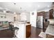 Spacious kitchen with granite countertops, stainless appliances, and open layout to living area at 128 Millen Dr, Mooresville, NC 28115