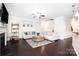 Inviting living room with dark floors, a fireplace, neutral colors, and plenty of natural light at 128 Millen Dr, Mooresville, NC 28115