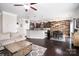 Open concept living area featuring a modern kitchen and comfortable living room setup at 128 Millen Dr, Mooresville, NC 28115
