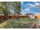 Large backyard featuring a shed, wooden fence, and a mix of grass and fallen leaves at 151 Birkdale Dr, Salisbury, NC 28144