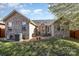 Inviting backyard patio with outdoor seating, grill, brick home, and green lawn at 151 Birkdale Dr, Salisbury, NC 28144