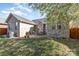 Brick home and patio with a grill and outdoor seating surrounded by a green lawn at 151 Birkdale Dr, Salisbury, NC 28144