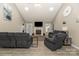 Bright living room featuring fireplace, TV, and neutral tones throughout at 151 Birkdale Dr, Salisbury, NC 28144