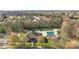 Aerial view of the community clubhouse and pool, surrounded by lush greenery and manicured landscaping at 15138 Callow Forest Dr, Charlotte, NC 28273