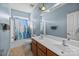A full bathroom with double vanity, tub/shower combo and blue walls at 15138 Callow Forest Dr, Charlotte, NC 28273