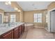 A spacious primary bathroom with a double vanity, soaking tub, and glass enclosed shower at 15138 Callow Forest Dr, Charlotte, NC 28273