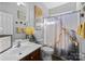 Cozy bathroom features vanity, toilet, and tub with decorative shower curtain at 15138 Callow Forest Dr, Charlotte, NC 28273