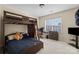 A bedroom featuring a wooden bunk bed, plush carpet, and natural light at 15138 Callow Forest Dr, Charlotte, NC 28273