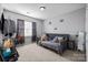 Bedroom with neutral walls, plush carpet, and window with natural light at 15138 Callow Forest Dr, Charlotte, NC 28273