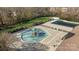 Aerial view of community pool and splash pad with well-maintained surroundings at 15138 Callow Forest Dr, Charlotte, NC 28273