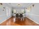 Bright dining room with hardwood floors, large windows, and stylish decor at 15138 Callow Forest Dr, Charlotte, NC 28273