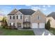 Beautiful two-story brick home with a well-kept lawn and a two-car garage at 15138 Callow Forest Dr, Charlotte, NC 28273